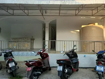 a group of motorcycles parked in front of a building at Kata S.T House 2 in Phuket Town