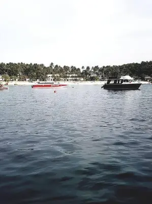 two boats in a large body of water at 53ft Sailing Yacht PHUKET Family Sailing adventure in Bang Tao Beach