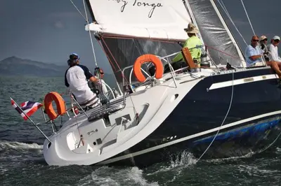 a group of people on a sailboat in the water at 53ft Sailing Yacht PHUKET Family Sailing adventure in Bang Tao Beach