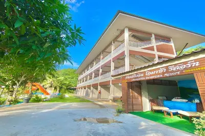 a large building with a sign in front of it at Chanpailin Omarzaa in Krabi town