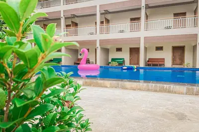 a swimming pool with a pink flamingo in a building at Chanpailin Omarzaa in Krabi town