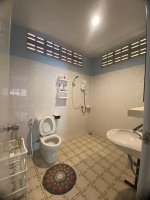 a bathroom with a toilet and a sink at Bohemian apartment at Ya Nui beach in Phuket Town