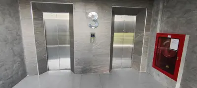 two elevators in a subway station with a red door at Relife The Windy in Phuket Town