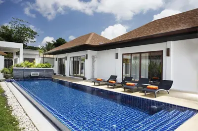 a swimming pool in the backyard of a villa at Exotic Boutique 4BR Pool Villa Toya, Gated Residence, Rawai in Rawai Beach