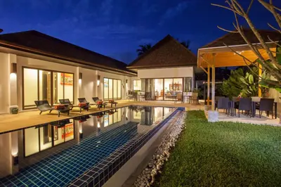 a house with a swimming pool in the yard at Exotic Boutique 4BR Pool Villa Toya, Gated Residence, Rawai in Rawai Beach