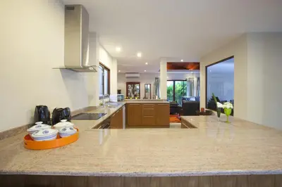 a kitchen with a large counter top in a room at Exotic Boutique 4BR Pool Villa Toya, Gated Residence, Rawai in Rawai Beach