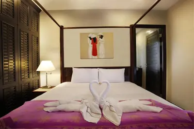 a bed with two towels in the shape of a heart at Exotic Boutique 4BR Pool Villa Toya, Gated Residence, Rawai in Rawai Beach