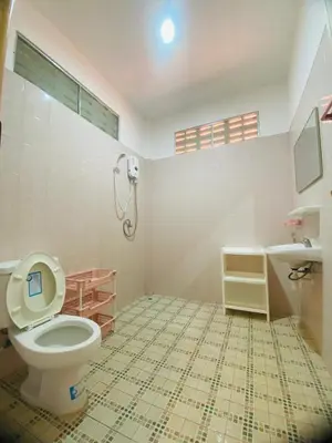 a bathroom with a toilet and a sink at Good vibes bungalow at Ya Nui beach in Phuket Town