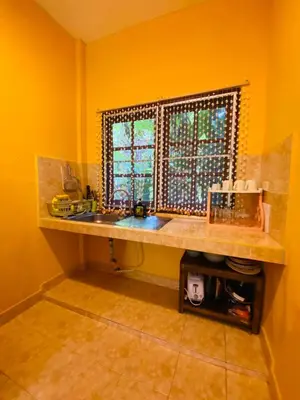 a kitchen with a sink and a window at Good vibes bungalow at Ya Nui beach in Phuket Town