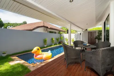 a swimming pool with a rubber duck toy on a deck at Sanook dream villas Nai Harn Beach in Rawai Beach