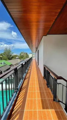 a balcony of a building with a view of the water at Twenty Two House in Patong Beach