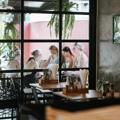 a group of women standing in front of a mirror at Twenty Two House in Patong Beach
