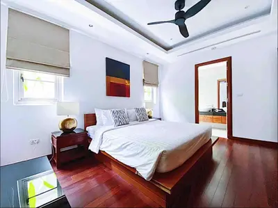 a bedroom with a bed and a ceiling fan at Luxe 2br Pool Villa walk to Bangtao Beach in Ban Thalat Choeng Thale