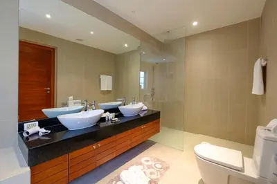 a bathroom with three sinks and a mirror at Luxe 2br Pool Villa walk to Bangtao Beach in Ban Thalat Choeng Thale