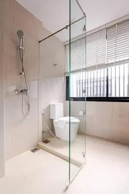 a bathroom with a glass shower and a toilet at LP 65-57 Spacious holiday home close to the beach in Phuket Town