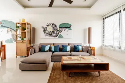 a living room with a couch and a coffee table at LP 65-57 Spacious holiday home close to the beach in Phuket Town
