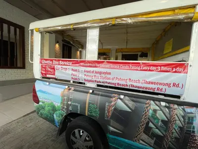a van with signs on the side of it at Emerald Terrace Condo 5-Studio Garden zen in Patong Beach