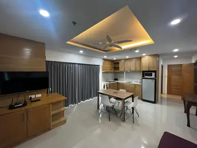 a kitchen with a table and a ceiling fan at Patong Tower Superior Apt 2 bedrooms 2 bathrooms in Patong Beach