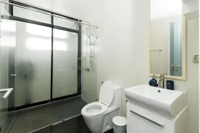 a bathroom with a toilet and a sink and a shower at Kamala family friendly pool villa by Lofty in Kamala Beach