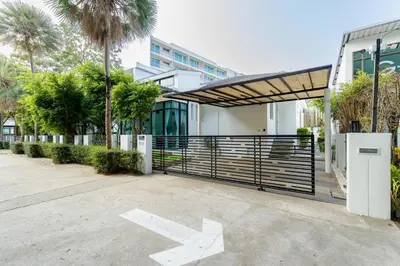 a building with a gate with an x painted on the ground at Kamala family friendly pool villa by Lofty in Kamala Beach