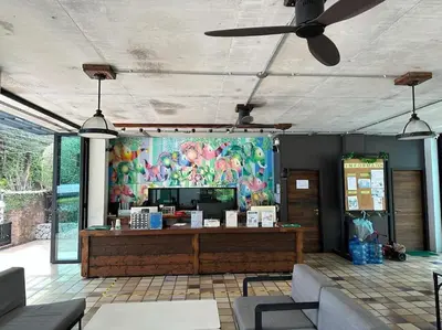 a restaurant with a counter with a colorful wall at Studio Title III, Rawai Phuket in Rawai Beach