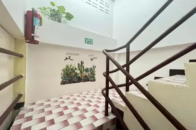 a staircase in a building with plants on the wall at Sonya Residence in Patong Beach
