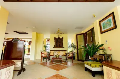 a living room with a table and chairs at Anyavee Aonang Bay in Ao Nang Beach
