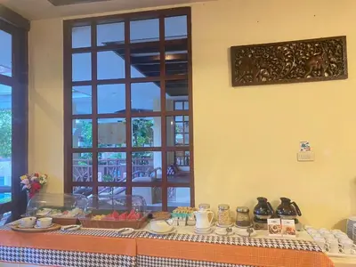 a table with food on it in front of a window at Anyavee Aonang Bay in Ao Nang Beach