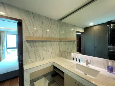 a bathroom with a sink and a large mirror at Luxury sea view apartment at Mida Grande in Surin Beach