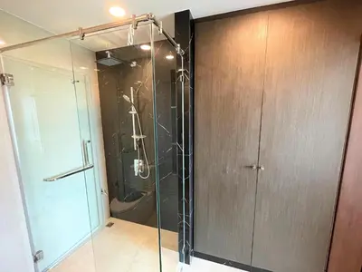 a bathroom with a shower with a glass door at Luxury sea view apartment at Mida Grande in Surin Beach