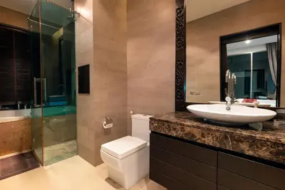 a bathroom with a sink and a toilet and a shower at Villa Sabine private pool 4br seaview jacuzzi in Rawai Beach