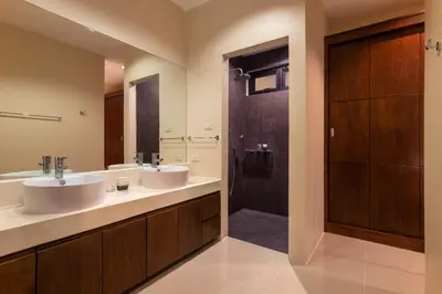 a bathroom with two sinks and a shower at Andaman 3br Private Pool Villa in Rawai Beach