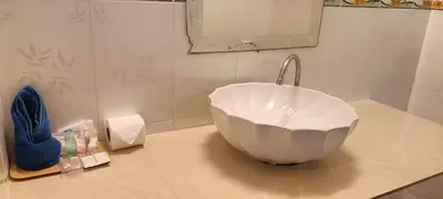 a bathroom with a bowl sink on a counter at Baan Suan Villas Resort in Ban Suan