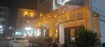 a building with christmas lights on the side of it at AINNY Residence in Patong Beach