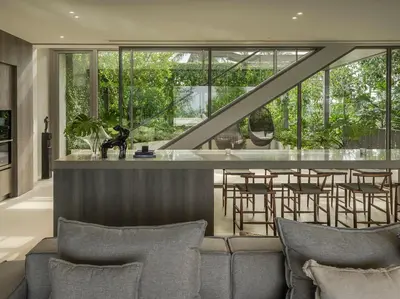 a living room with a couch and a bar at Veyla Natai Residences - Luxury Pool Villa in Khok Kloi