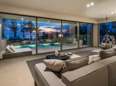 a living room with a couch and a large window at Veyla Natai Residences - Luxury Pool Villa in Khok Kloi
