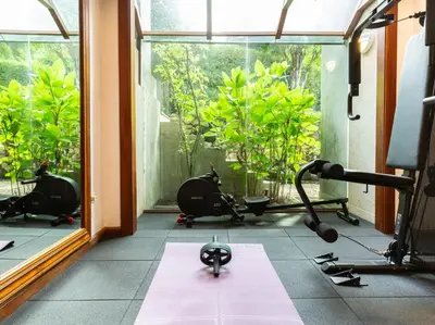 a room with a gym with a lot of exercise equipment at Infinity View by Elite Havens in Kata Beach