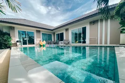 a swimming pool in front of a villa at Private Pool Villa at Nai Harn 2 bedroom in Rawai Beach