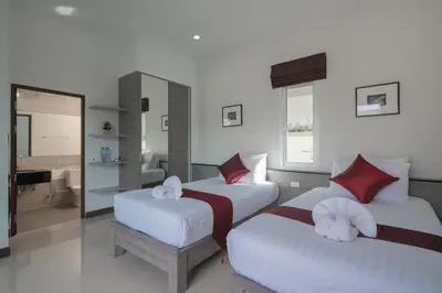 a hotel room with two beds and a bathroom at Private Pool Villa at Nai Harn 2 bedroom in Rawai Beach