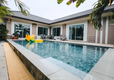 a swimming pool with a banana float in a house at Private Pool Villa at Nai Harn 2 bedroom in Rawai Beach