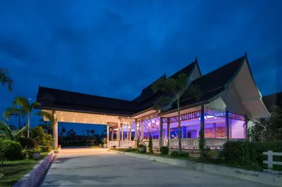 a building with purple lights on it at night at Private Pool Villa at Nai Harn 2 bedroom in Rawai Beach