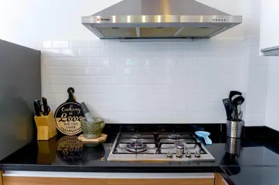 a kitchen counter with a stove top in a kitchen at Villa Charming - Lovely 2 bedrooms house with pool in Rawai Beach