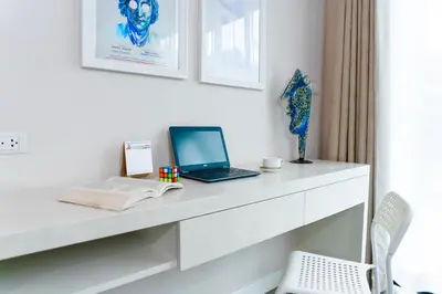 a white desk with a laptop and a book at Villa Charming - Lovely 2 bedrooms house with pool in Rawai Beach