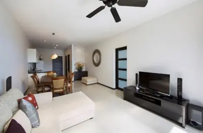 a living room with a couch and a flat screen tv at Вилла с бассейном на Най Харн, 3 спальни G7 in Rawai Beach