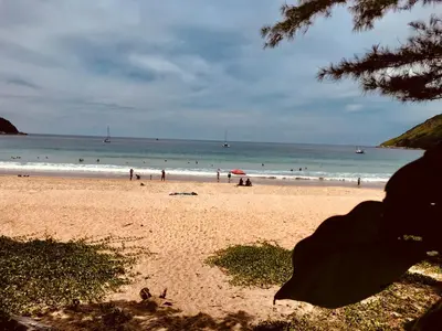 a group of people on a beach with the ocean at Вилла с бассейном на Най Харн, 3 спальни G7 in Rawai Beach