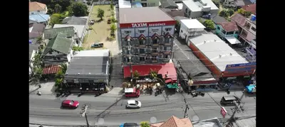 an overhead view of a busy city street with cars at Taxim Boutique Hotel in Patong Beach