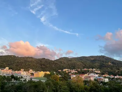 a view of a city with buildings and a mountain at BAOBAB in Patong Beach