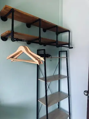 a shelf in a room with wooden shelves at MILD ROOM SEA VIEW ROOM FOR RENT in Phi Phi Don