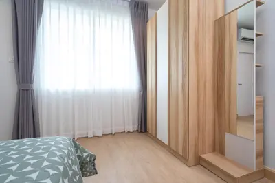 a bedroom with a bed and a large window at 2BR Homey townhome 350M walk to Kata Beach Fully equipped in Kata Beach