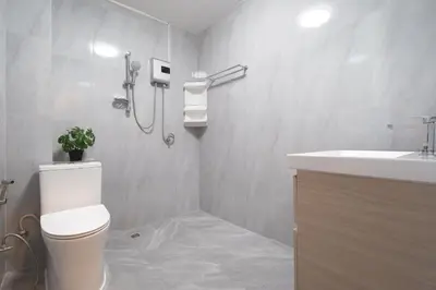 a bathroom with a toilet and a sink at 2BR Homey townhome 350M walk to Kata Beach Fully equipped in Kata Beach
